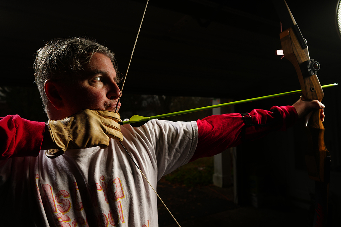 Instructor aiming bow