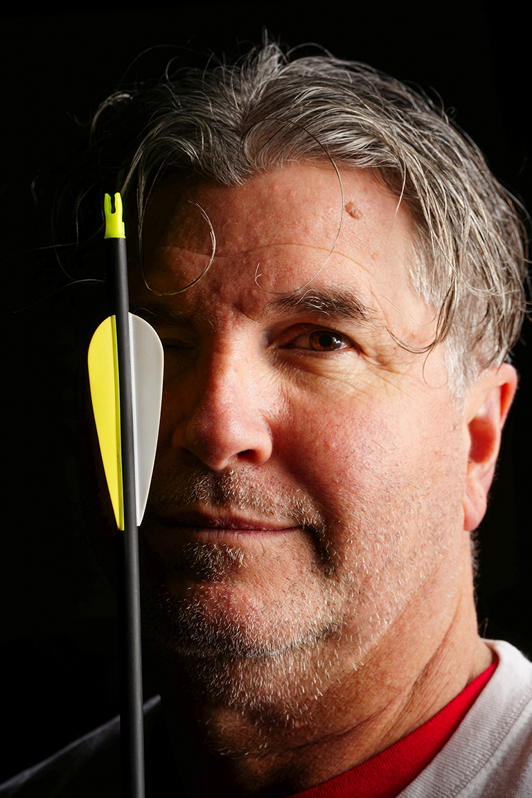 Instructor with target and arrows